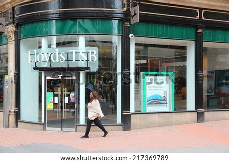 BIRMINGHAM, UK - APRIL 19, 2013: Person walks by Lloyds TSB bank in Birmingham, UK. Lloyds Banking Group had GBP 23.5 billion of revenue in 2011