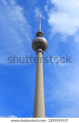 Similar – Image, Stock Photo Berlin television tower at Alexanderplatz and street lamp in historical style parallel and reflecting the sunlight against the blue sky with partly light cloud cover