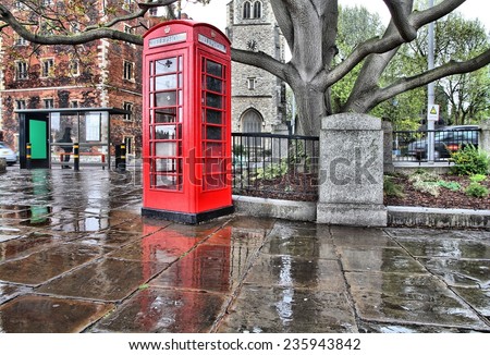 London, United Kingdom - red telephone box in the rain. HDR image.