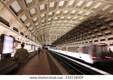 WASHINGTON, USA - JUNE 13, 2013: People wait for subway train in Washington. With 212 million annual rides in 2012 Washington Metro is the 3rd busiest rapid transit system in the USA.