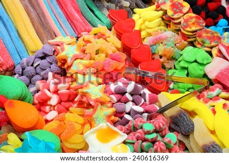 Confectionery shop at Boqueria market in Barcelona, Spain. Colorful gumdrops and wine gum sweets.