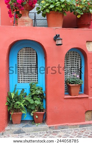Chania, town on Crete island in Greece. Old town architecture with flowers.