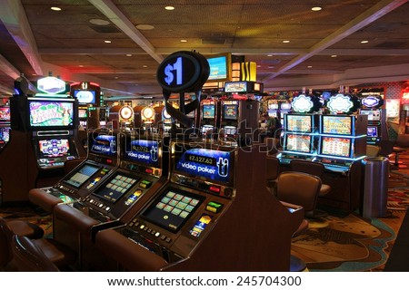 LAS VEGAS, USA - APRIL 14, 2014: People visit Treasure Island casino resort in Las Vegas. It is one of 30 largest hotels in the world with 2,884 rooms.
