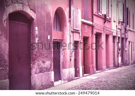 Modena, Italy - Emilia-Romagna region. Colorful Mediterranean architecture. Cross processed color tone - retro image filtered style.
