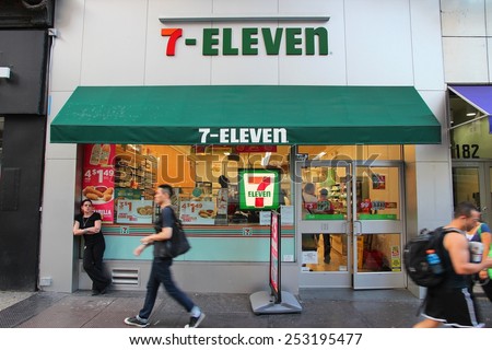 NEW YORK, USA - JULY 3, 2013: People walk past 7-Eleven convenience store in New York. 7-Eleven is world\'s largest operator, franchisor and licensor of convenience stores, with more than 46,000 shops.
