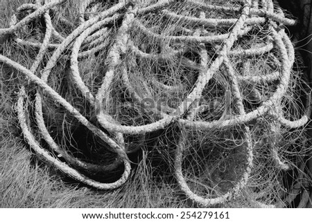 Fishing net bundle in a harbor in Iceland. Black and white tone.