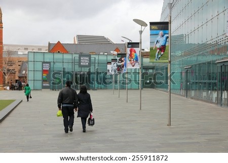 MANCHESTER, UK - APRIL 23, 2013: People visit National Football Museum in Manchester, UK. After it was opened in 2012 it was visited by 350,000 people in 9 months.