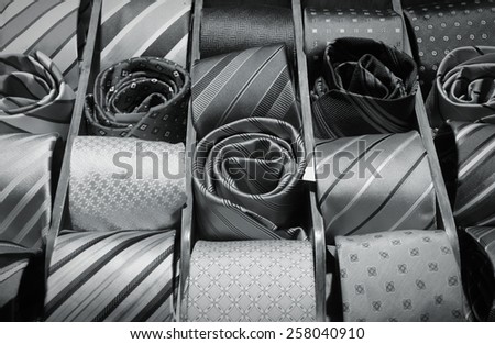 Fashion shop choice elegant dressing accessories. Neck ties at a store in Italy. Black and white tone.