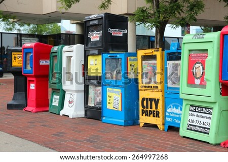 BALTIMORE, USA - JUNE 12, 2013: City newspapers in Baltimore. Baltimore is the largest city in the state of Maryland. The Daily Record newspaper was founded in 1888.