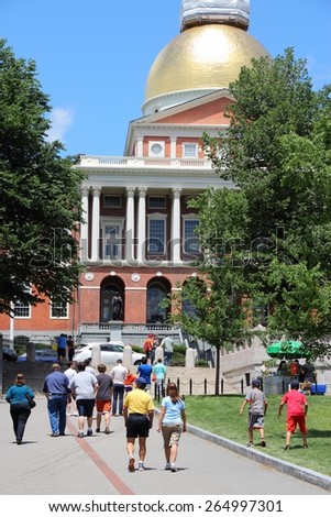 BOSTON, USA - JUNE 9, 2013: People visit the State House in Boston. Boston is the largest city in Massachusetts with estimated 2014 population of 645,966.