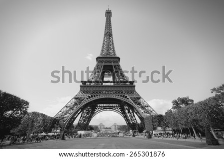 Paris, France - Eiffel Tower seen from Champ de Mars. UNESCO World Heritage Site. Black and white toned photo.