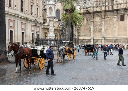 SEVILLE, SPAIN - NOVEMBER 3, 2012: People visit Old Town in Seville, Spain. Seville is a major tourism destination in Spain with 4.8 million hotel-nights in 2011.