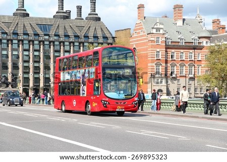 LONDON, UK - MAY 16, 2012: People ride London Bus in London. As of 2012, LB serves 19,000 bus stops with a fleet of 8000 buses. On a weekday 6 million rides are served.