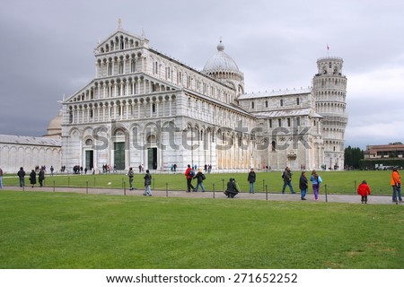 PISA, ITALY - OCTOBER 21, 2009: People visit the cathedral in Pisa, Italy. Duomo square is a UNESCO World Heritage Site and Italy is the 5th most visited country in the world (46 million in 2012).