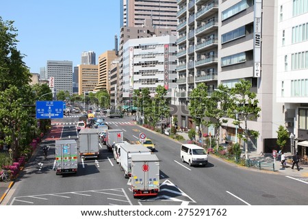 TOKYO, JAPAN - MAY 11, 2012: People drive cars in Tokyo. With 591 vehicles per capita, Japan is a country with one of highest car ownership rates.