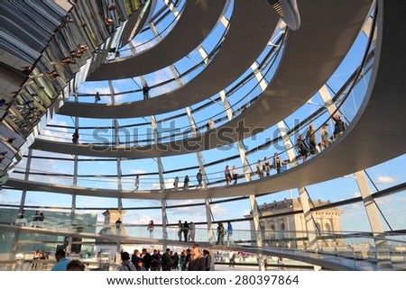 BERLIN, GERMANY - AUGUST 27, 2014: People visit Reichstag building dome in Berlin. The dome was completed in 1999. It was designed by architect Norman Foster.