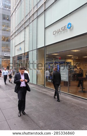 NEW YORK, USA - JULY 1, 2013: People walk by Chase Bank branch on in New York. JPMorgan Chase Bank is one of Big Four Banks of the US. It has 5,100 branches and 16,100 ATMs.