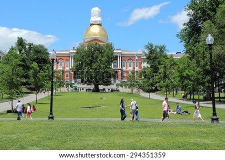 BOSTON, USA - JUNE 9, 2013: People visit the State House in Boston. Boston is the largest city in Massachusetts with estimated 2014 population of 645,966.