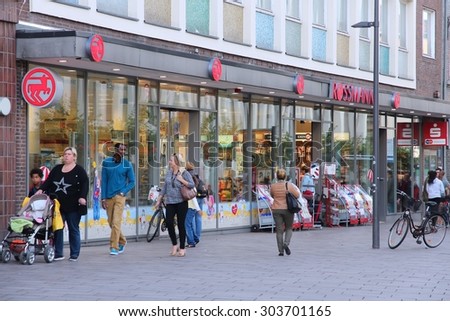LUBECK, GERMANY - AUGUST 29, 2014: People shop in Lubeck, Germany. Lubeck is the 2nd largest city in Schleswig-Holstein region.