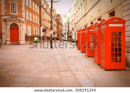 London, United Kingdom - red telephone boxes of Broad Court, Covent Garden. Retro photo filtered style.