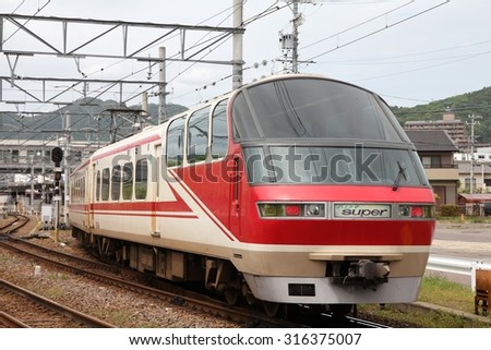 INUYAMA, JAPAN - MAY 3, 2012: Meitetsu Limited Express Series 1000 travels on Inuyama Line in Japan. More than 57,000 people travel daily on this line (2008 data).