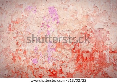 Grunge red concrete background - urban decay texture with peeling paint.