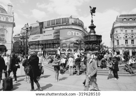 LONDON, UK - MAY 13, 2012: People visit Piccadilly Circus in London. With more than 14 million international arrivals in 2009, London is the most visited city in the world (Euromonitor).