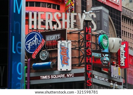 NEW YORK, USA - JULY 3, 2013: Famous Hershey\'s ad at Times Square in New York. Hershey Company is a chocolate manufacturer founded in 1894. It employs 13,700 people (2010).