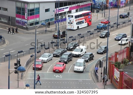 BIRMINGHAM, UK - APRIL 19, 2013: People drive cars in Birmingham, UK. Birmingham is the most populous British city outside London with 1.07 million residents.