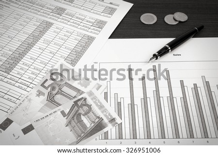 Business composition. Financial analysis - income statement, ink pen and Euro money. Black and white retro style.