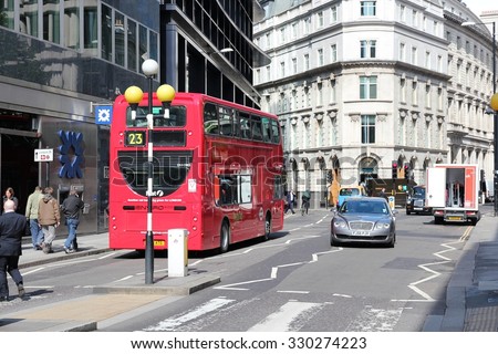 LONDON, UK - MAY 15, 2012: People ride London Bus in London. As of 2012, LB serves 19,000 bus stops with a fleet of 8000 buses. On a weekday 6 million rides are served.