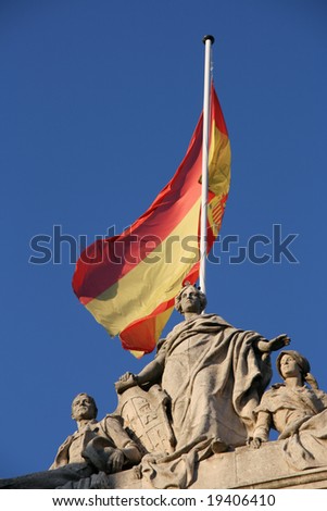 Spanish flag and sculptures in Palencia, Spain