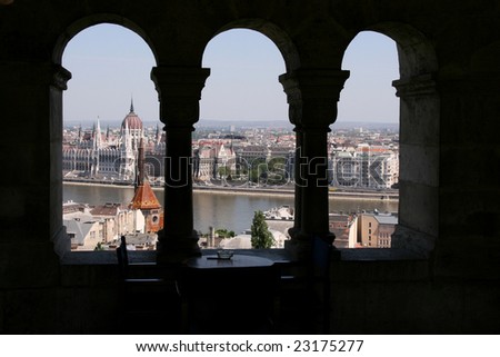 Parliament view through the arch of Fishermen\'s Bastion on castle hill, Budapest.