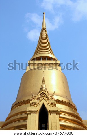 Thai Buddhist temple in Bangkok, Thailand. Golden stupa - Phra Sri Rattana Chedi, belongs to Wat Phra Kaew (famous Temple of the Emerald Buddha).