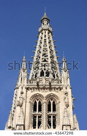 Tower top of medieval cathedral in Burgos, Castilia, Spain. Old Catholic church listed on UNESCO World Heritage List.