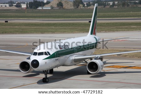 BOLOGNA - SEPTEMBER 19: Airbus A320 of Alitalia airline taxis on September 19, 2009 at Bologna International Airport. This is the new company operating Alitalia brand, which went bankrupt in 2008
