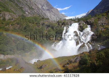 Norway, Jostedalsbreen National Park. Famous waterfall originating from Briksdalsbreen glacier in Briksdalen valley.
