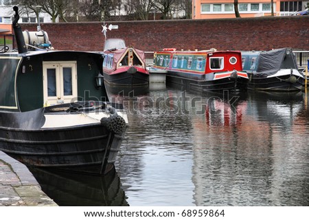 Birmingham water canal network - barge homes, typical houseboats. West Midlands, England.