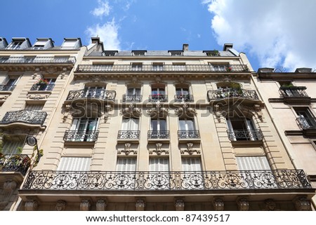 Paris, France - typical old apartment building. Windows and balconies.