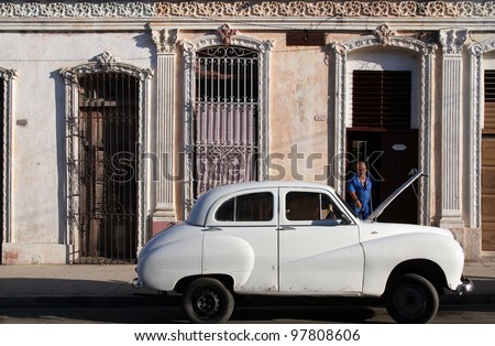 CIENFUEGOS, CUBA - FEBRUARY 3: Classic old car in the street on February 3, 2011 in Cienfuegos, Cuba. Recent law change allows the Cubans to trade cars again. Old law resulted in very old cars in Cuba