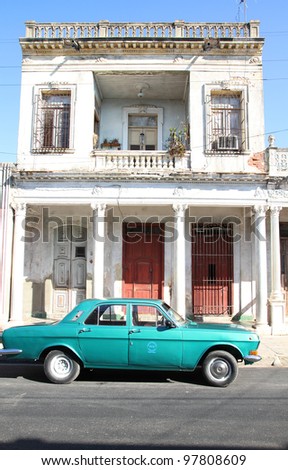 CIENFUEGOS, CUBA - FEBRUARY 3: Classic old car in the street on February 3, 2011 in Cienfuegos, Cuba. Recent law change allows the Cubans to trade cars again. Old law resulted in very old cars in Cuba