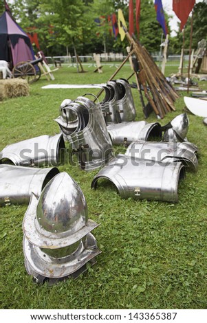 Helmets and medieval armor parts, detail of an ancient war armor, pain and destruction