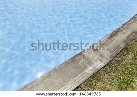 Swimming with wood, detail of a summer pool in the city, water and fun