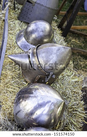 Old medieval helmets, detail of some ancient war helmets, protection and destruction