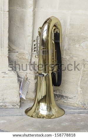 Trombone gold in the street, wind instrument detail in the street music of a band
