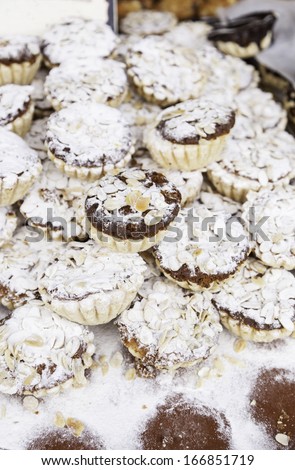 Homemade muffins with almonds, detail artisan bakery dessert, sweet dessert of modern life