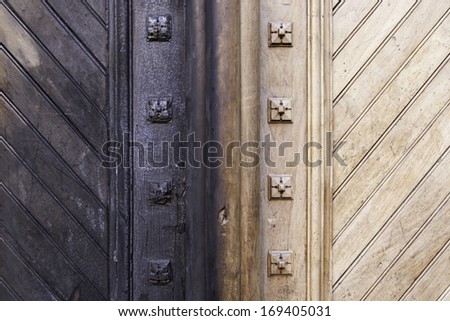 Ancient wooden door burned, detail of a wooden door burned in a fire, disaster