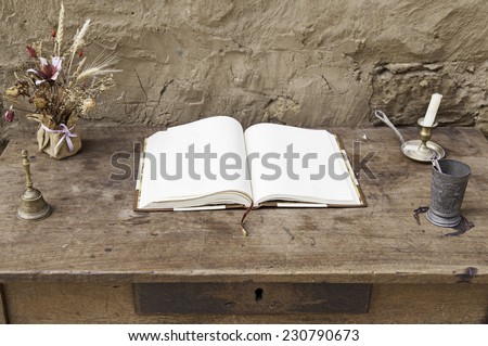 Empty book on a wooden table, detail of a blank book