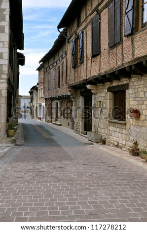 Street and typical building of old village of Castelnau of Montmiral in southern France, Midi  region, Tarn department