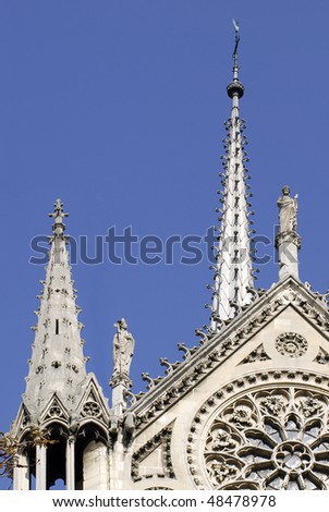 Spire and rose window of the Notre Dame Cathedral of Paris of the south facade